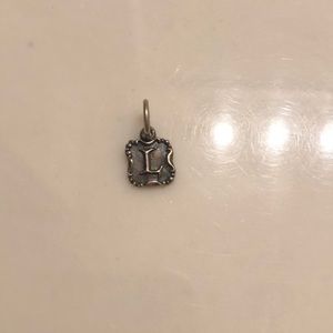 Waxing Poetic Crest Insignia Letter “L” Charm